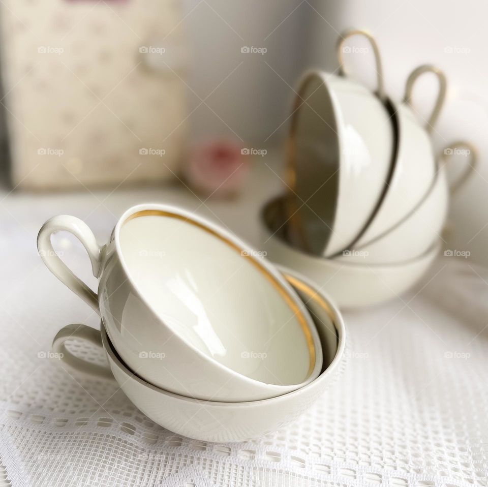 Vintage porcelain cups in cream color