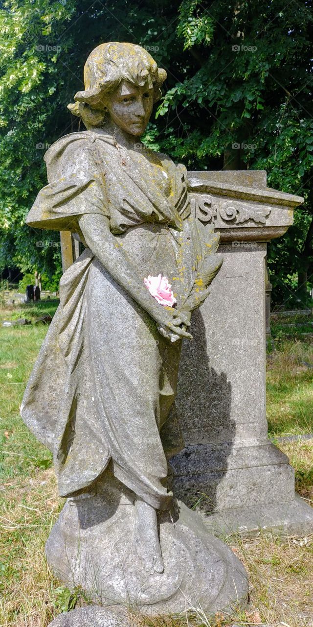 Victorian tomb with stone carved angel statue