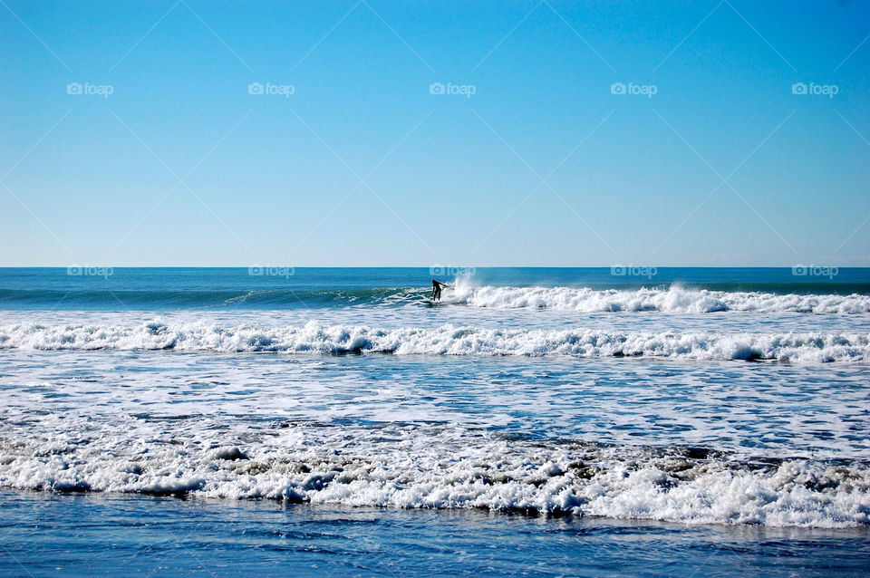 Surfer on New Brighton beach