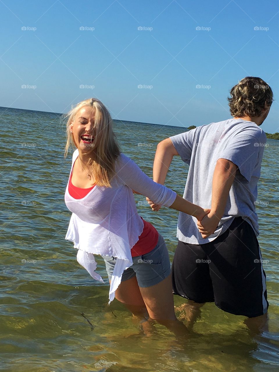 Happy couple enjoying in sea water