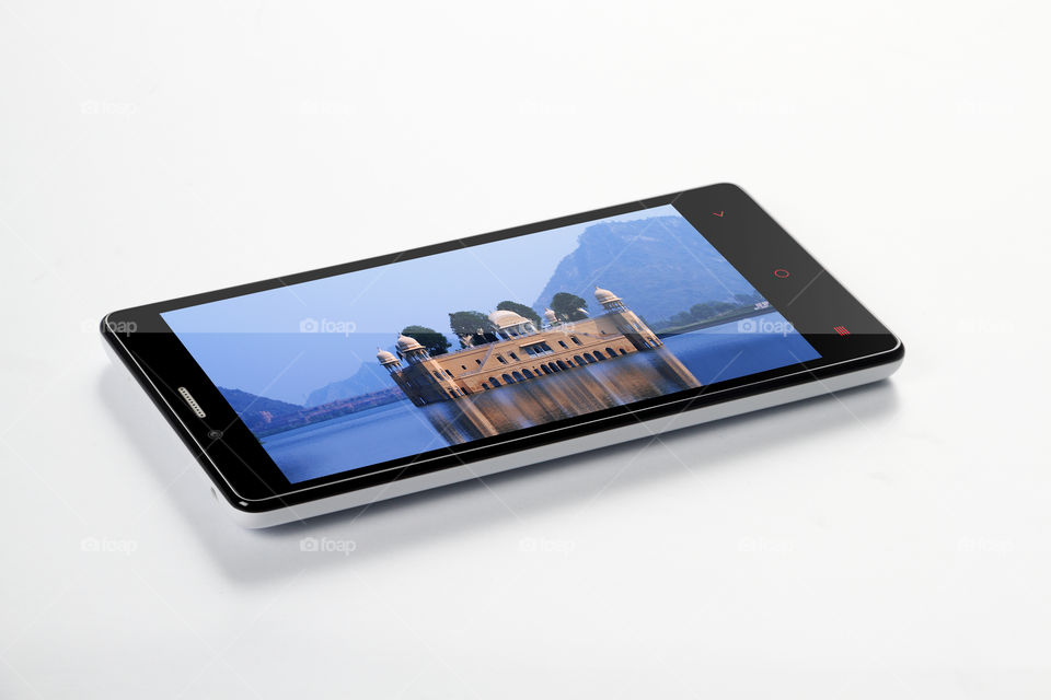 Mobile phone with Water palace, Rajasthan on the screen