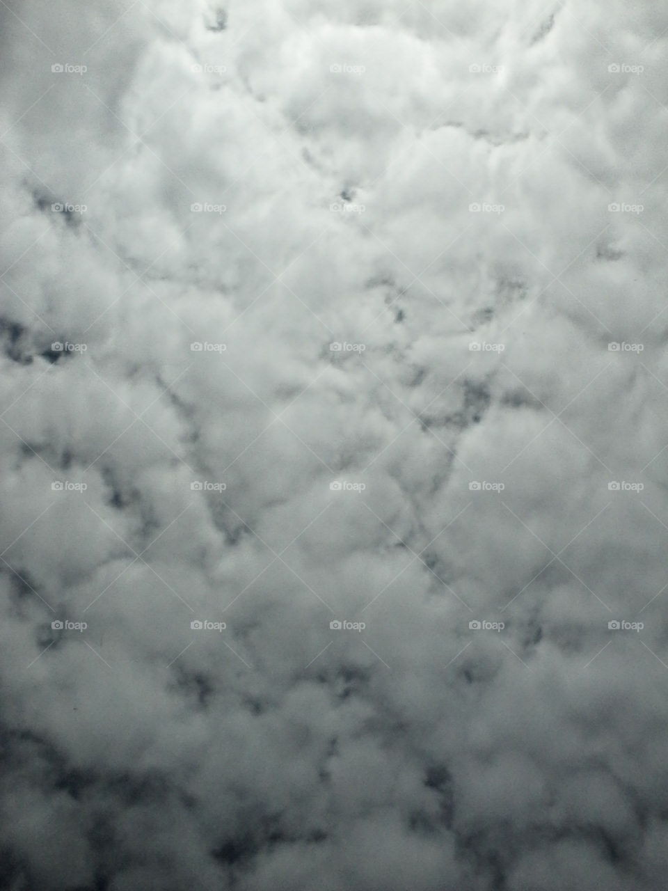 Billowing White Clouds Covering Blue Sky