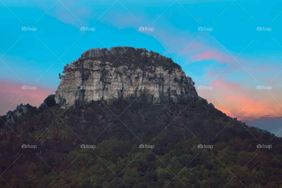 Sunset at pilot knob with rich blue sky and pink shadows.