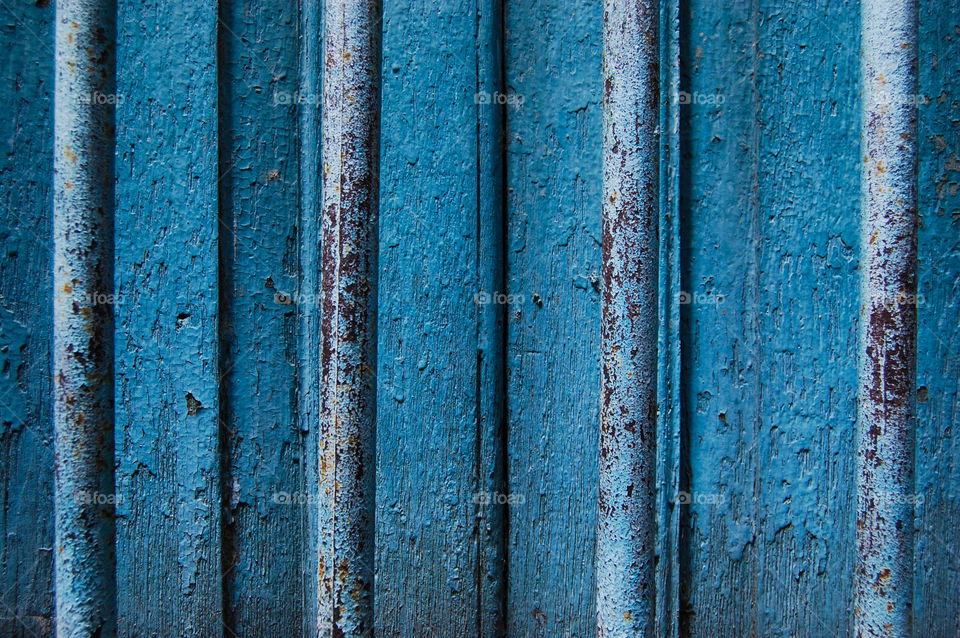 Bars on a old door.