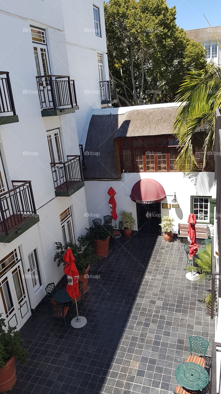 hotel courtyard in Stellenbosch, South Africa. The building was built by the 10th governer of South Africa who was the one to proclaim this new town in 1692.