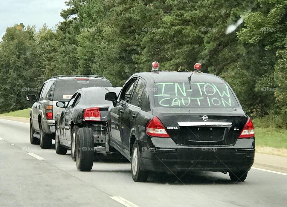 Automobiles being towed on the interstate.  I 65 south Alabama