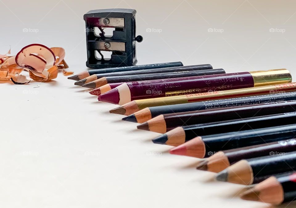 Assorted cosmetic pencils in various sizes and colours, all neatly sharpen