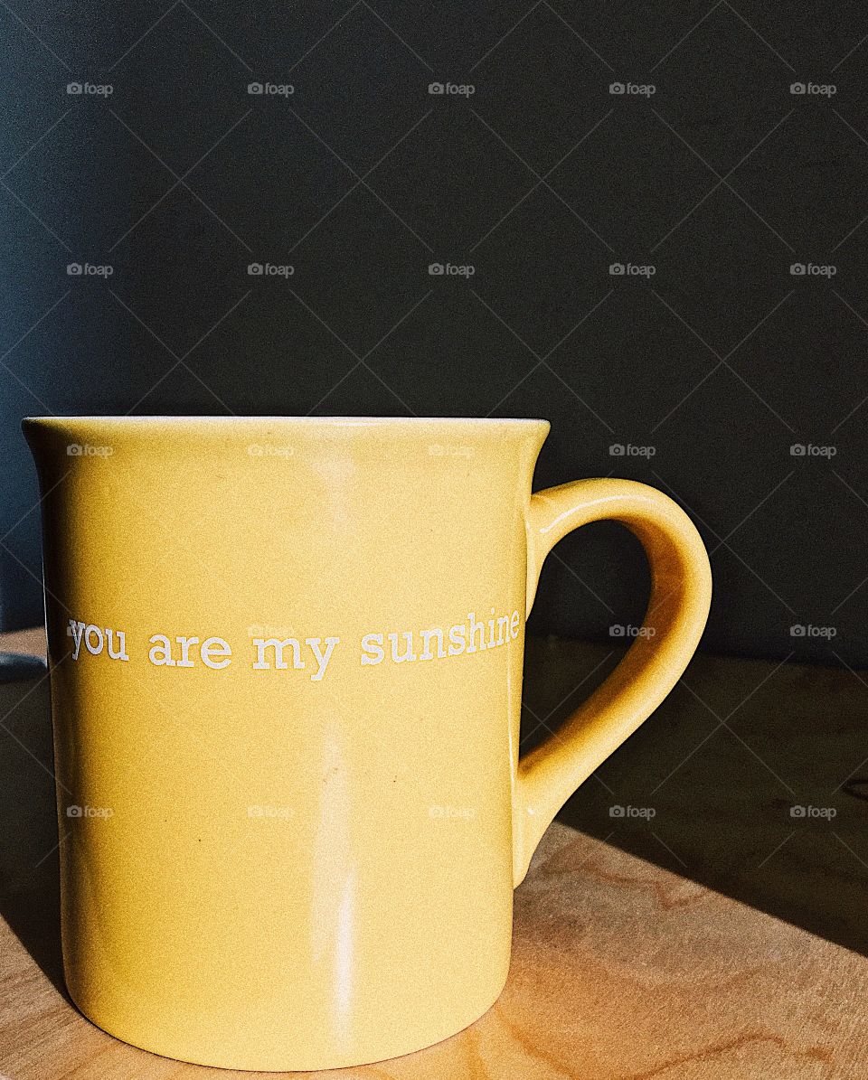 Yellow desk mug with a happy saying