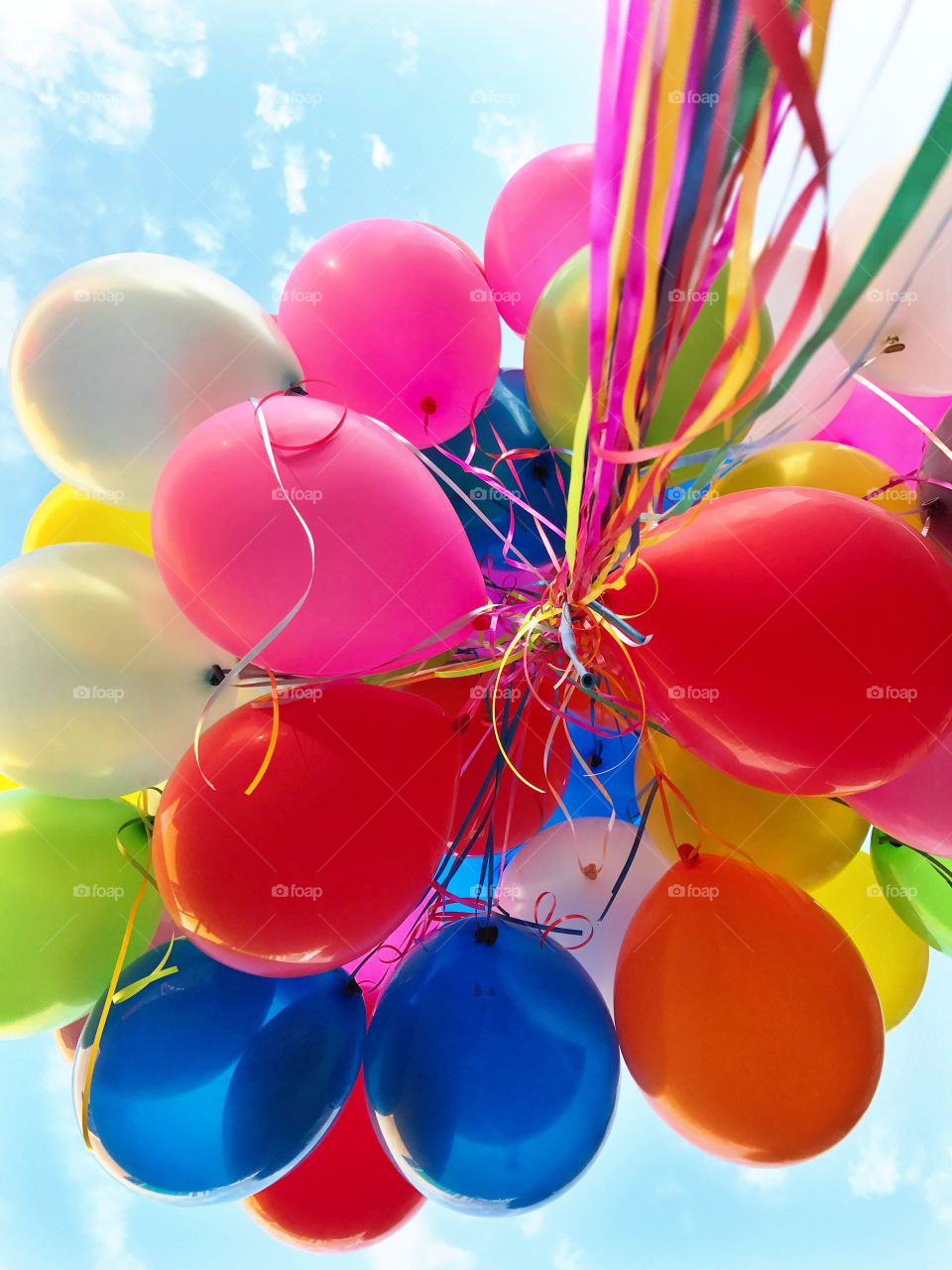 Happiness is holding a bunch of balloons 