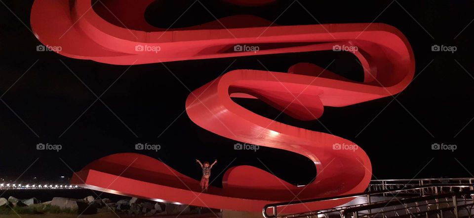 child on top of the statue of saints