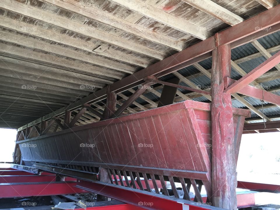 Feeders inside old barn. Barn has beams under it for relocation. 