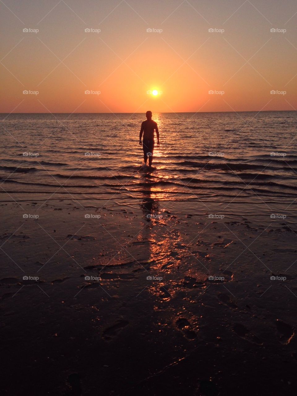 beach sunset sand man by mmonteiro