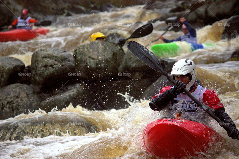 Helsinki, Finland - April 17, 2016: Unidentified racer at the annual iceBREAK whitewater kayaking competition at the Vanhankaupunginkoski rapids in Helsinki, Finland.