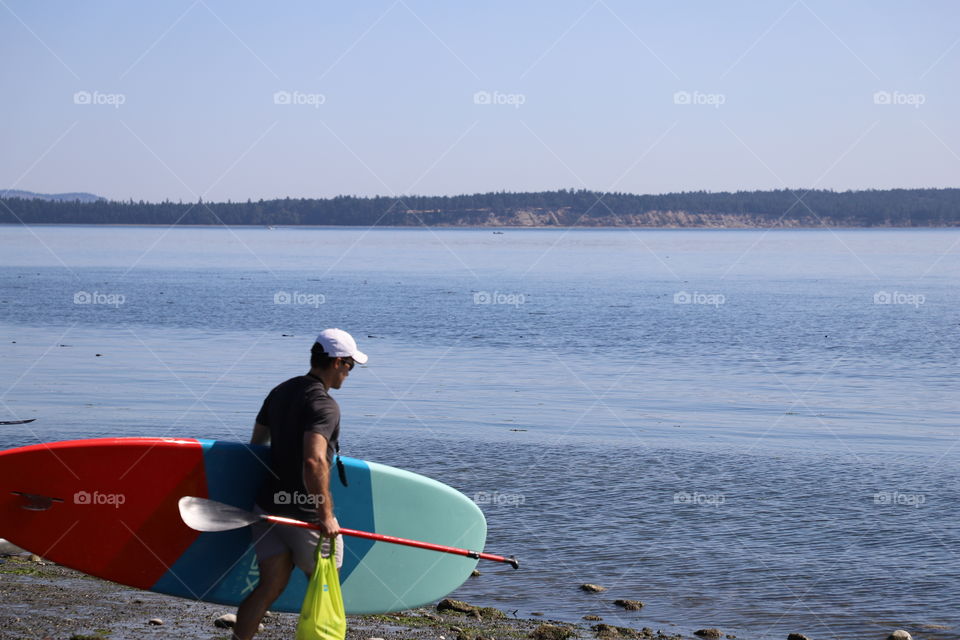 Man carrying a paddle nosied