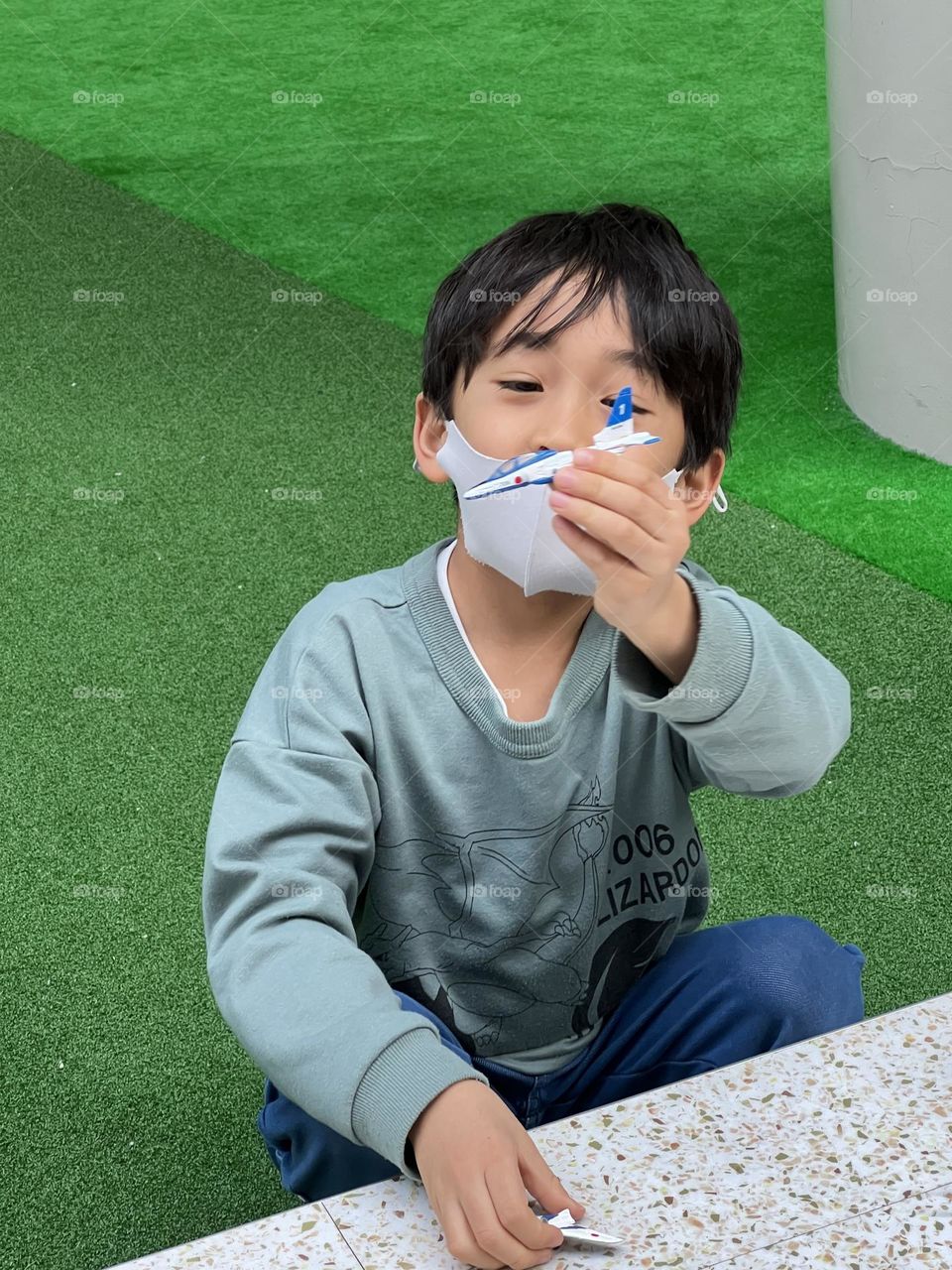 A kid is playing with his favorite toy.