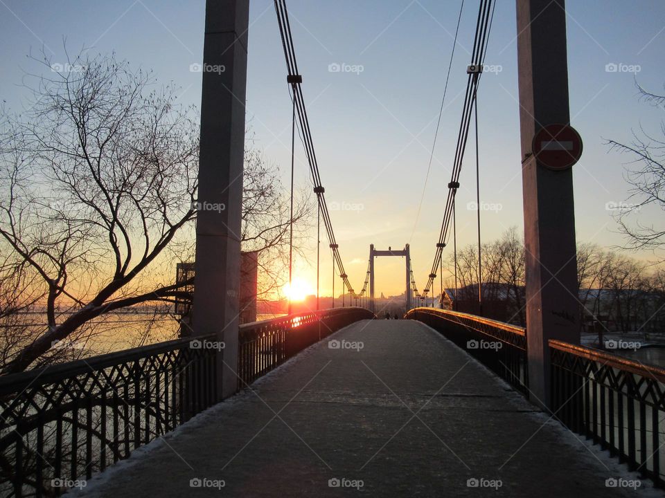 suspension bridge across the Voronezh river, sunset, evening