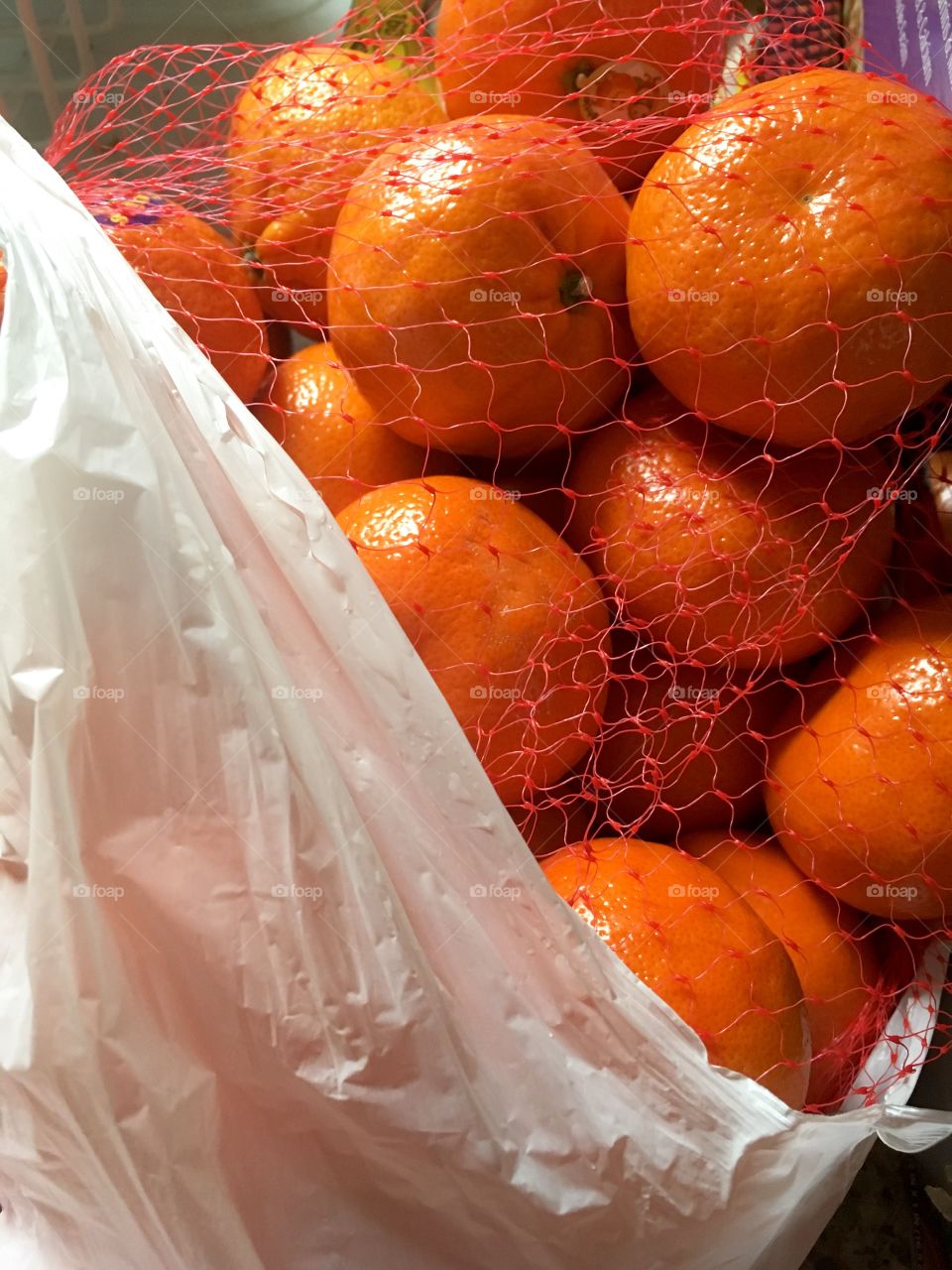 Oranges in a recyclable bag. 