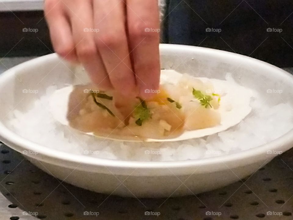 chef adding finishing touches