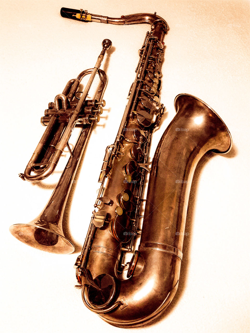 brass musical instruments. trumpet and saxophone in brass