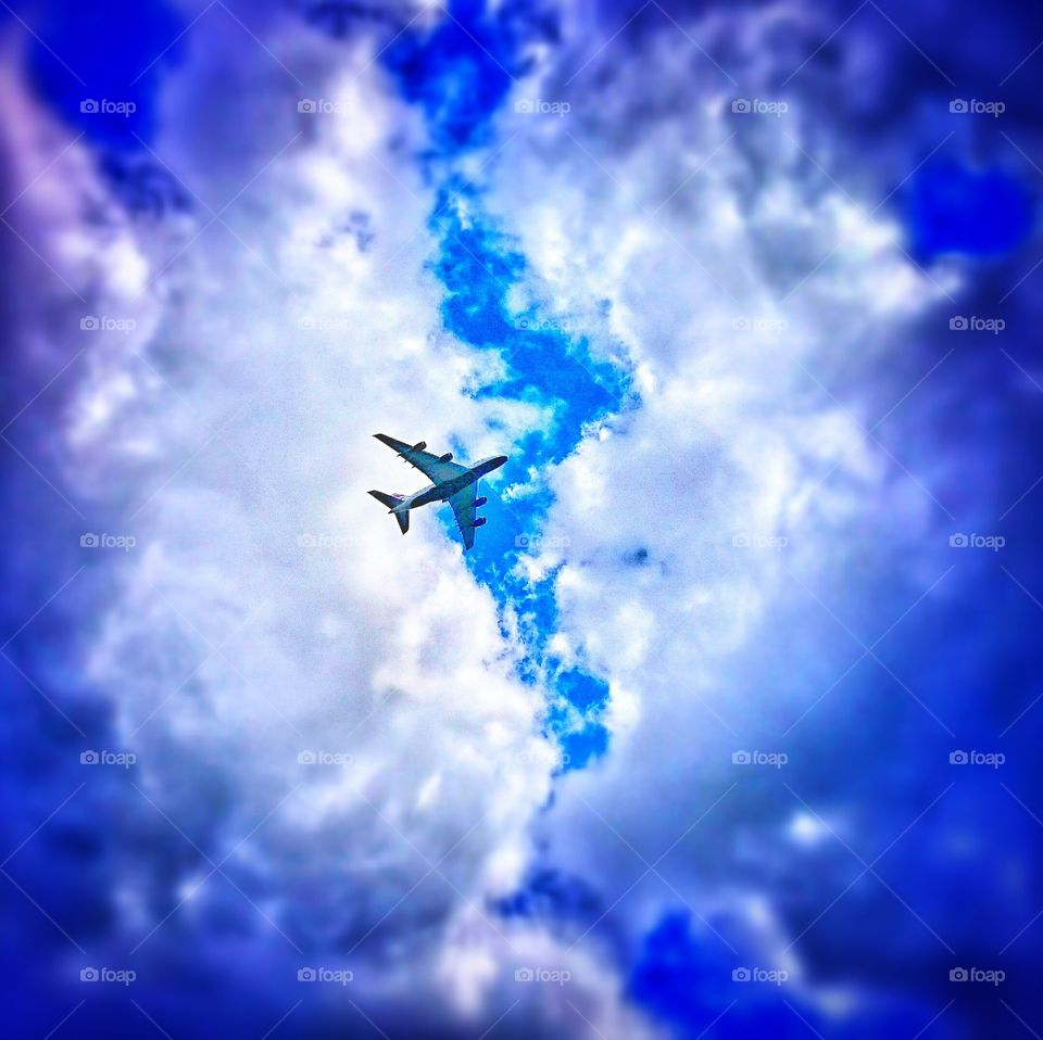 blue sky . jet in the clouds 