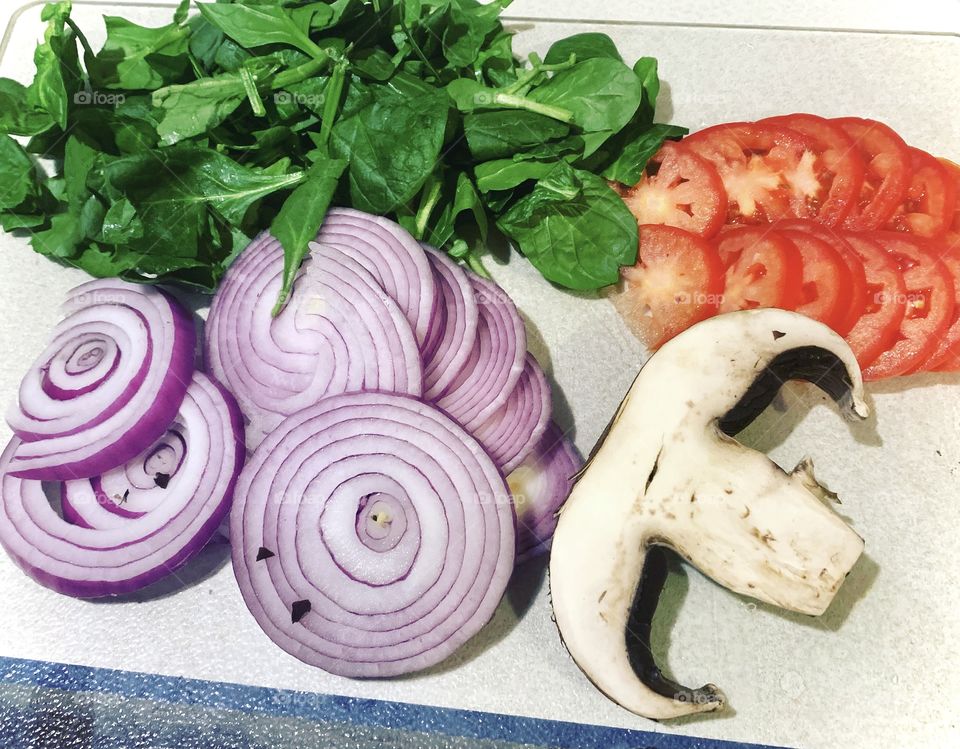 Fresh Ingredients. Tomato, spinach, red onions, and a slice of portobello mushroom. 