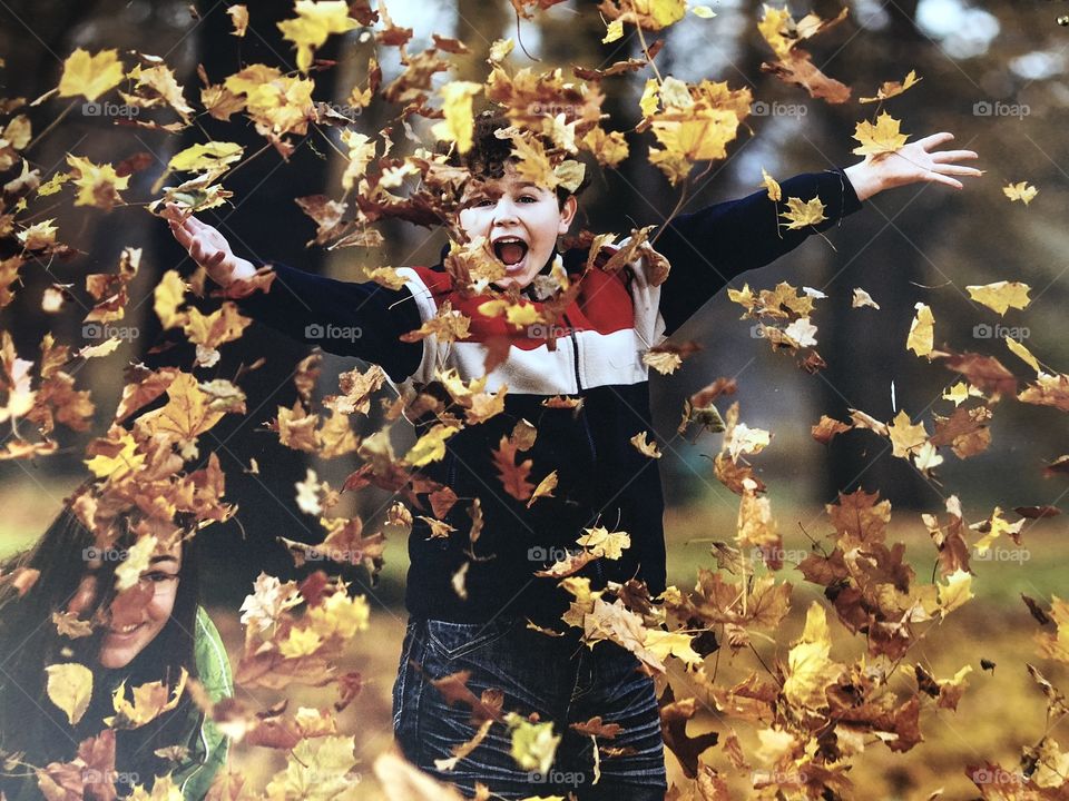 A photo of a photo of a child who can certainly throw an “autumn” party, joy is portrayed here, joy that is not always displayed for autumn.