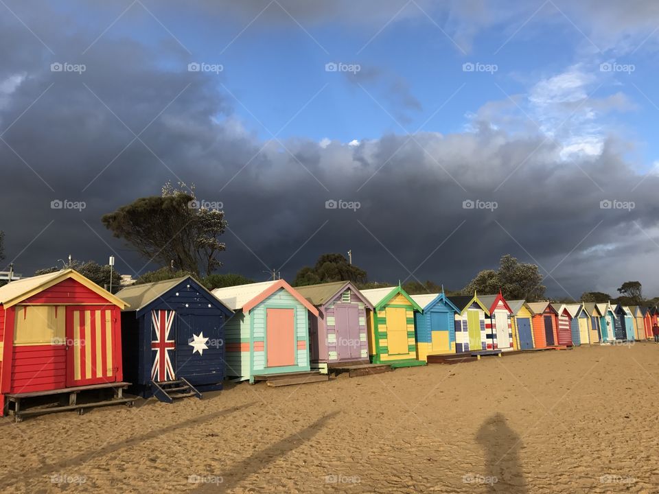 Brighton Bathing Boxes with a big storm behind. Melbourne Victoria Australia 