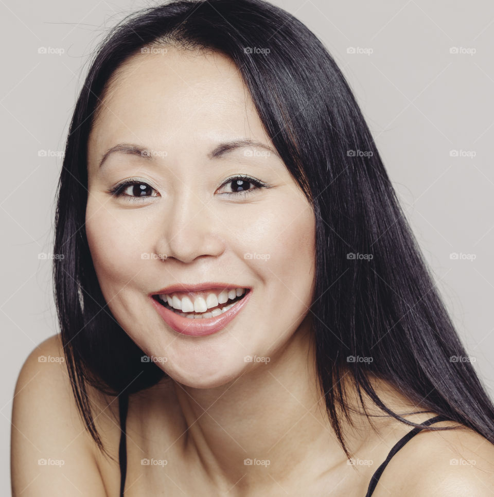 Asian woman of Japanese decent smiling 