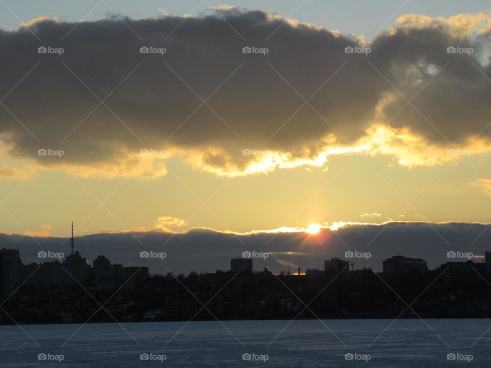 evening, sunset, March, ice on the river, sky and clouds
