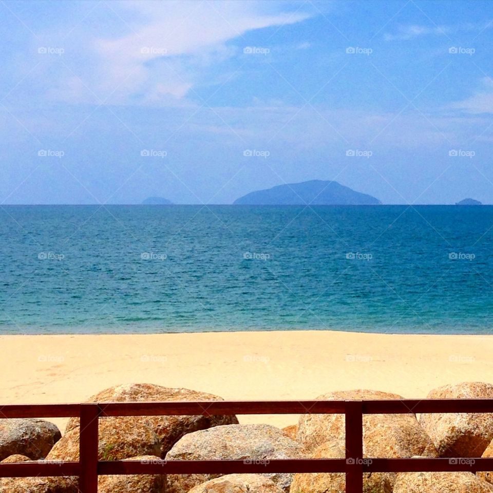 The sand, the water and the sky. Beach of Rhu Tapai in Terengganu, Malaysia