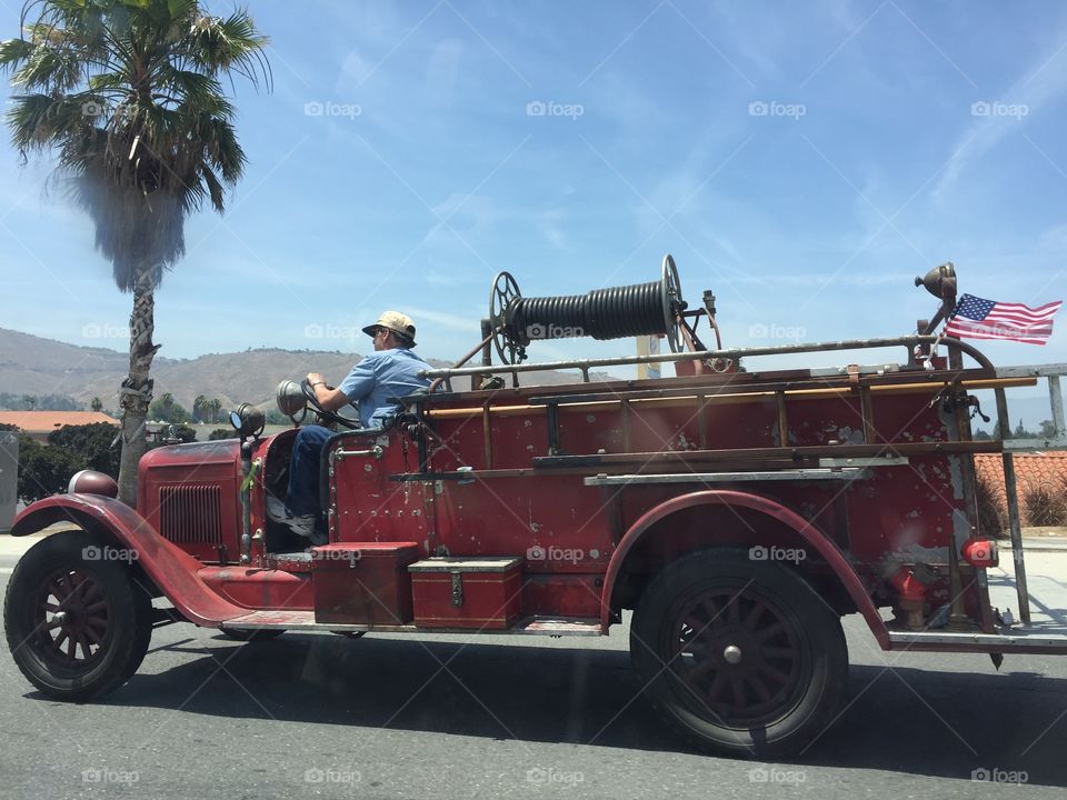 Guy on what looks like an old fire engine