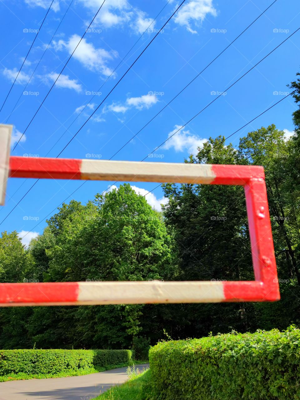 view of the park through the passage frame of the barrier