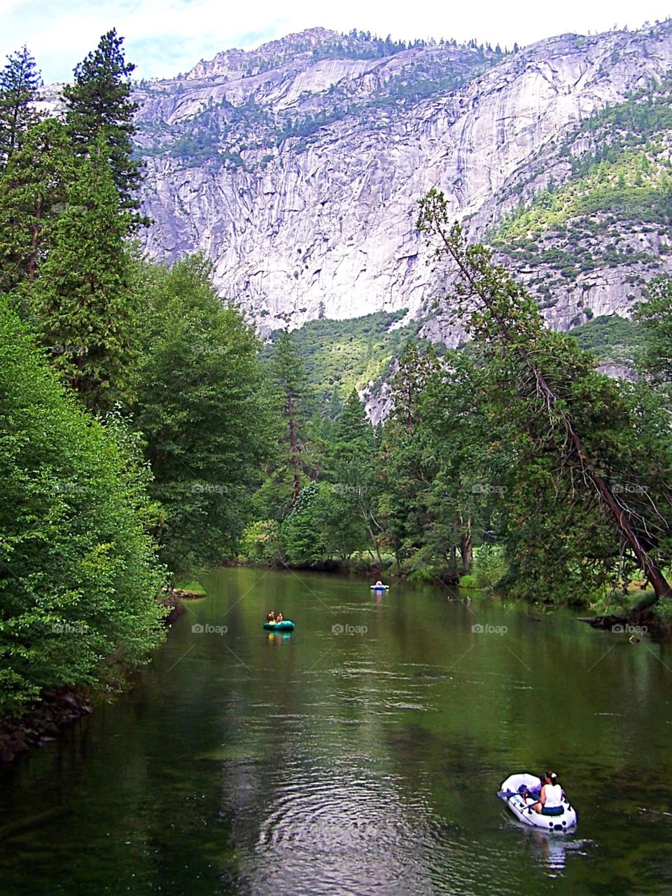 Boaters on a river through Yosemite National Park