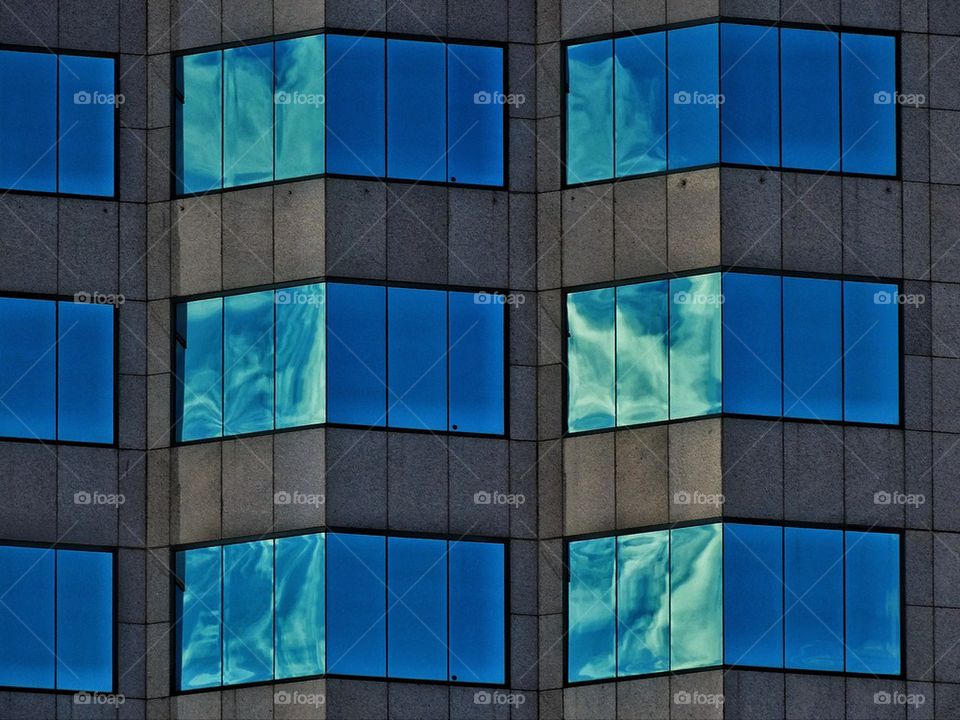 Cloud reflecting off window