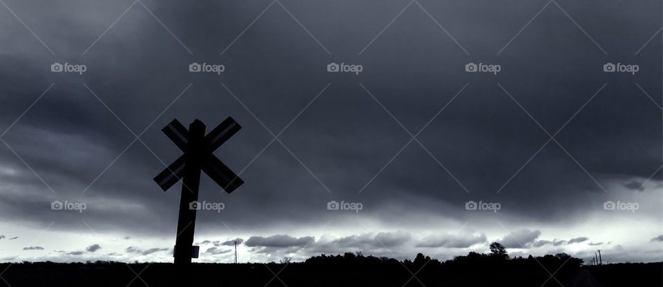 sky silhouette crossing railroad by detrichpix