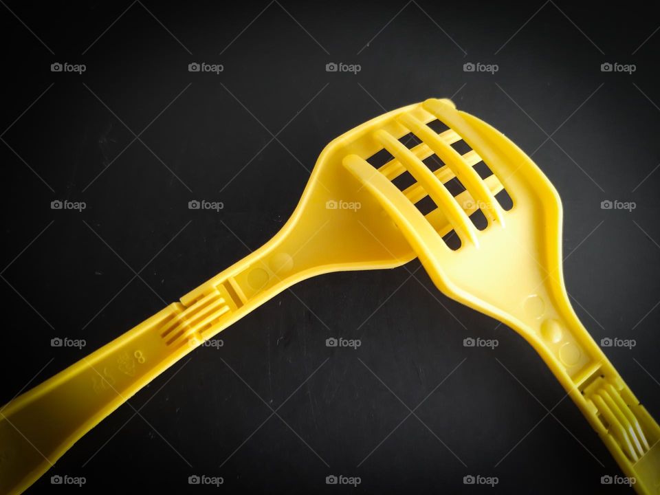 Yellow Forks on a black background