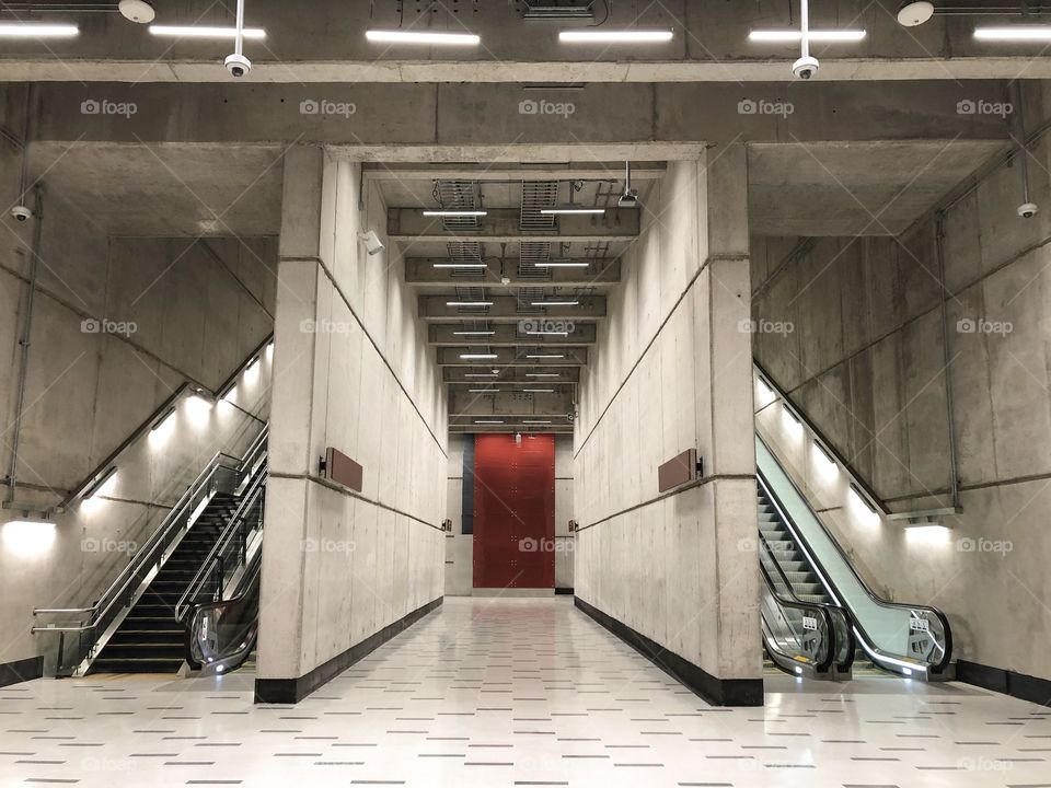 long corridor with red detail in the background