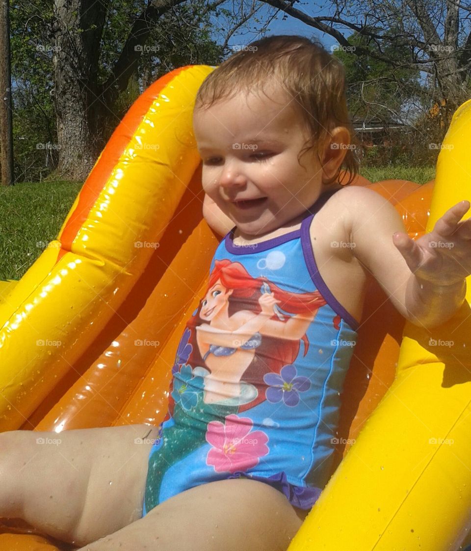 Pool Slide. She absolutely loves her pool!