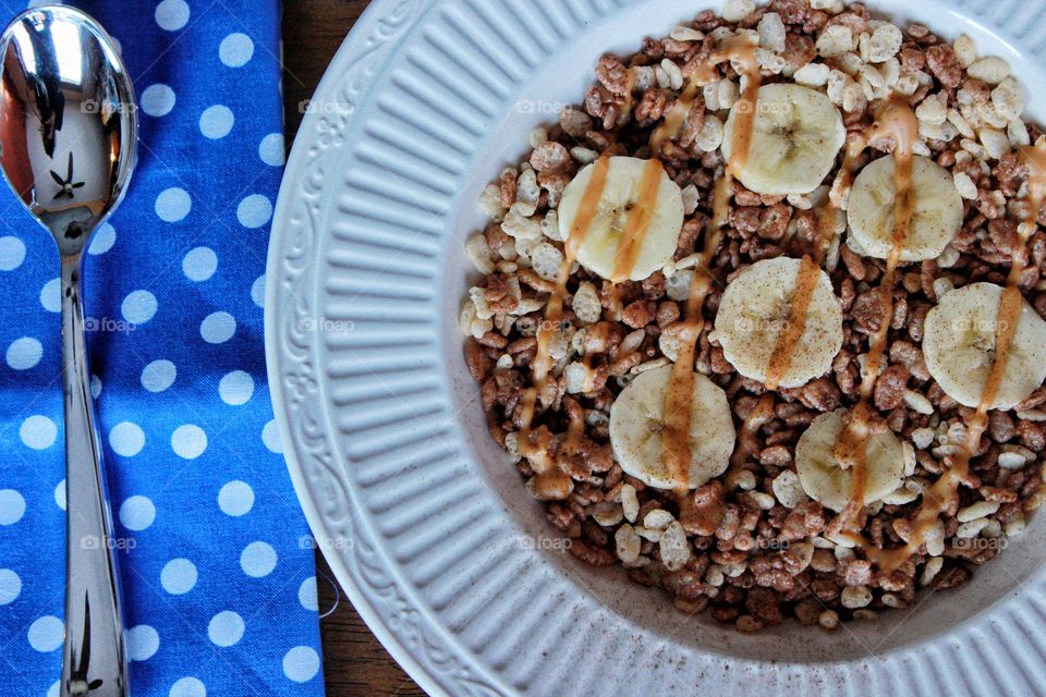 Breakfast with cereal and banana slice