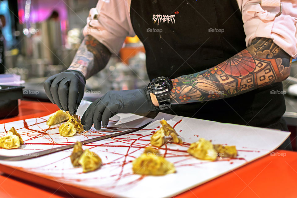 Chef cooking dumplings on a high cuisine restaurant