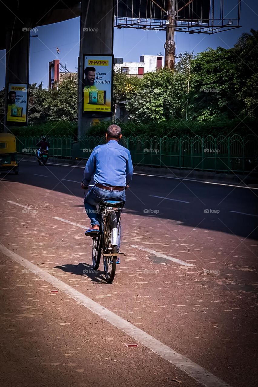 Man riding his vintage Bicycle