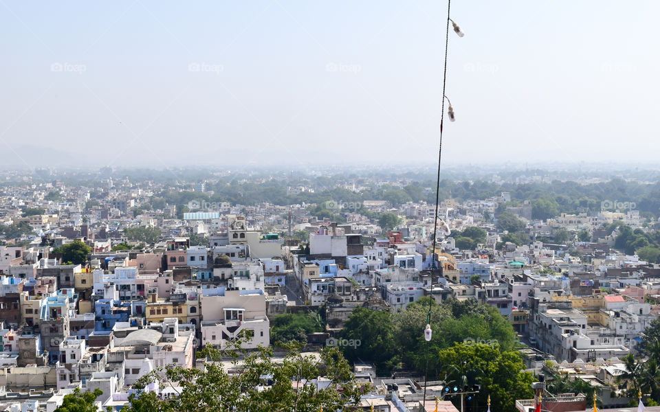 Udaipur, Rajasthan, India May 2019 - The beautiful panoramic landscape Aerial view of Udaipur City skyline. Lots of buildings can be seen in distant.
