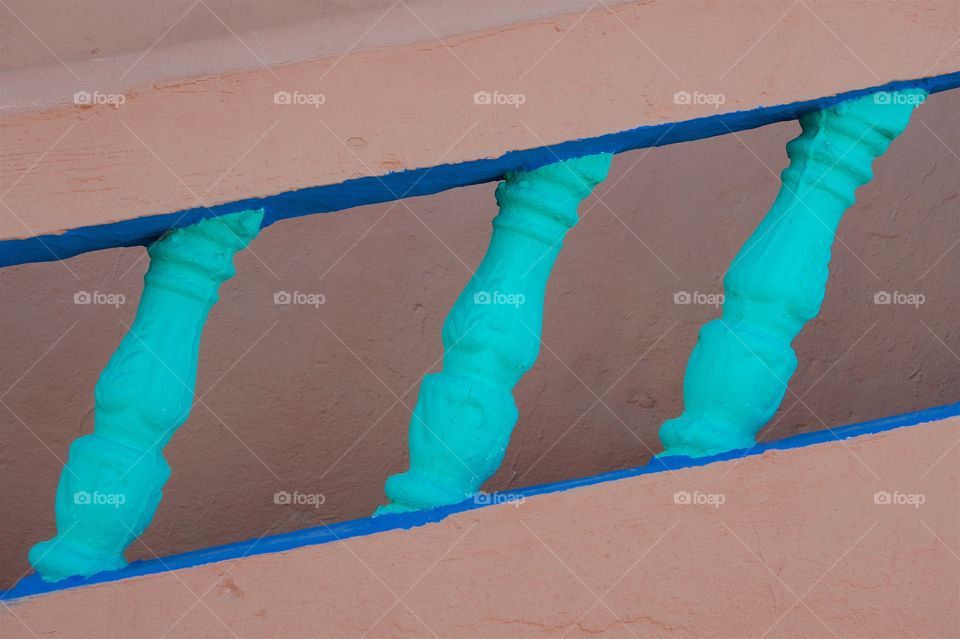 An abstract view of an outside stone banister in Essaouira, Morocco.