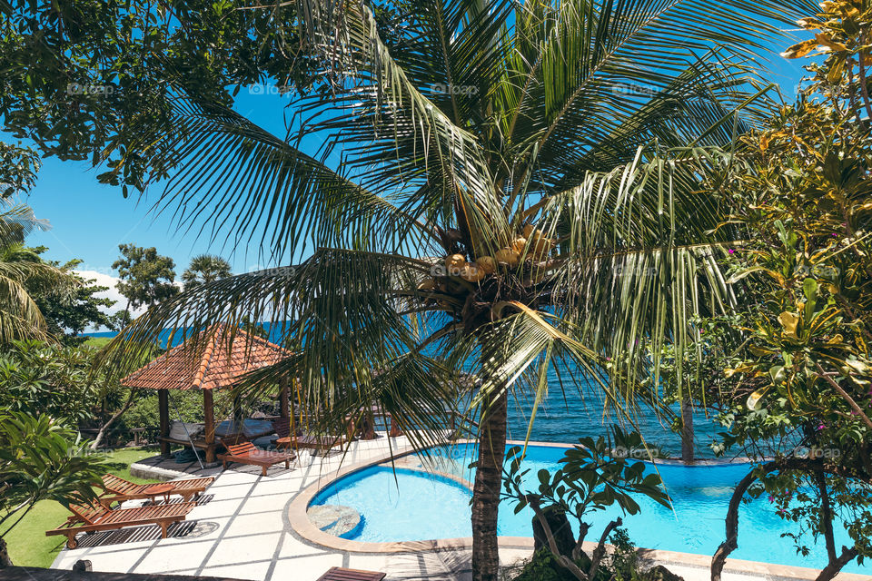 Tropic pool overlooking the Indian Ocean. Bali island, Indonesia. 