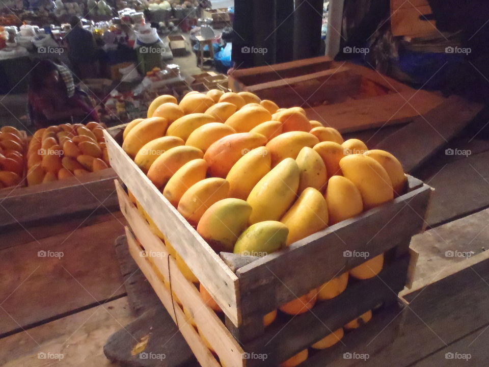 Crate of mangoes . Wooden crate of ripe mangoes at Solala Market in Guatemala 