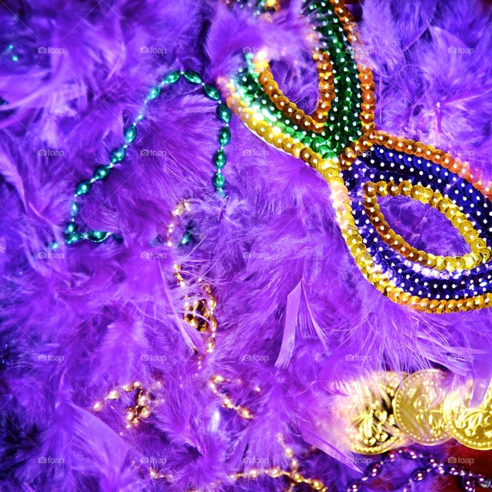 Carnival mask with purple feathers