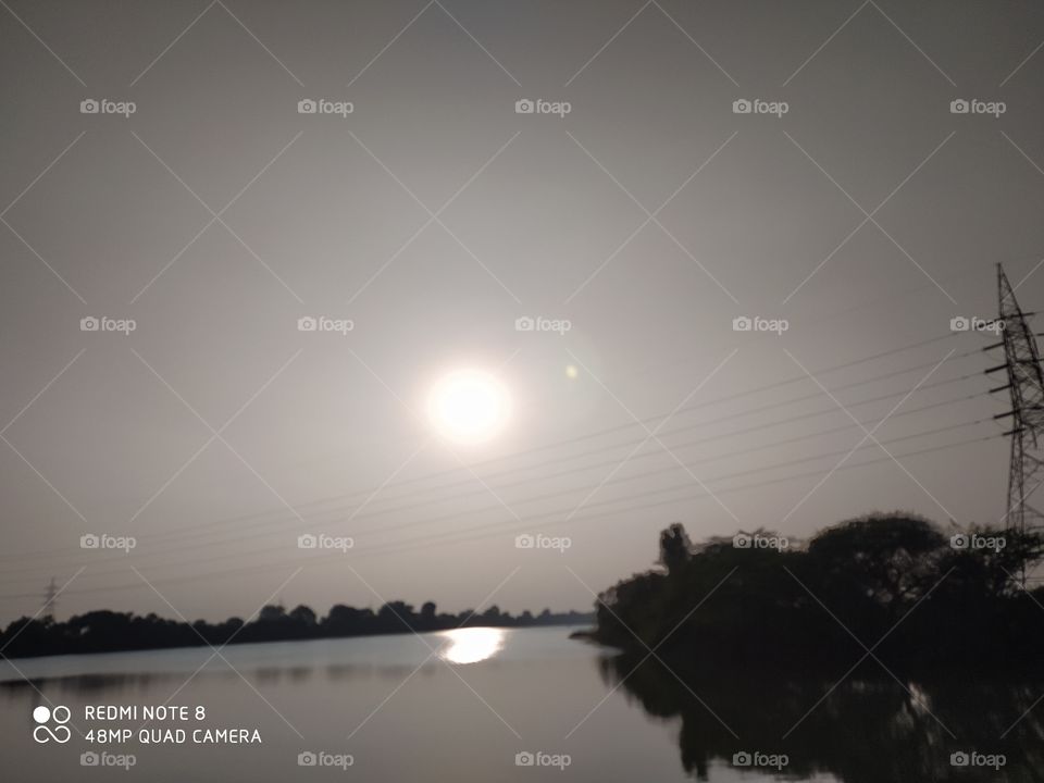 sun sprayed shines in evening