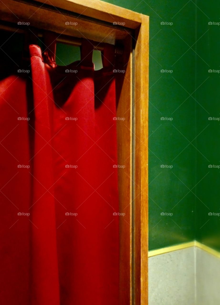 Red curtain hanging between rooms.