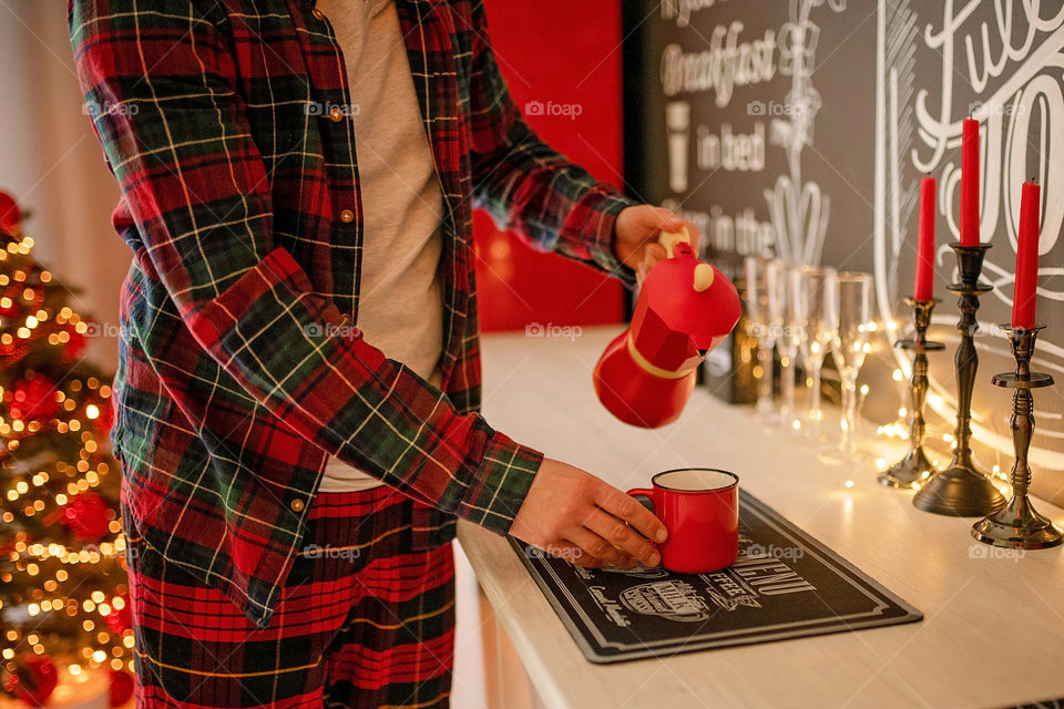 cup of coffee in a cozy festive Christmas atmosphere