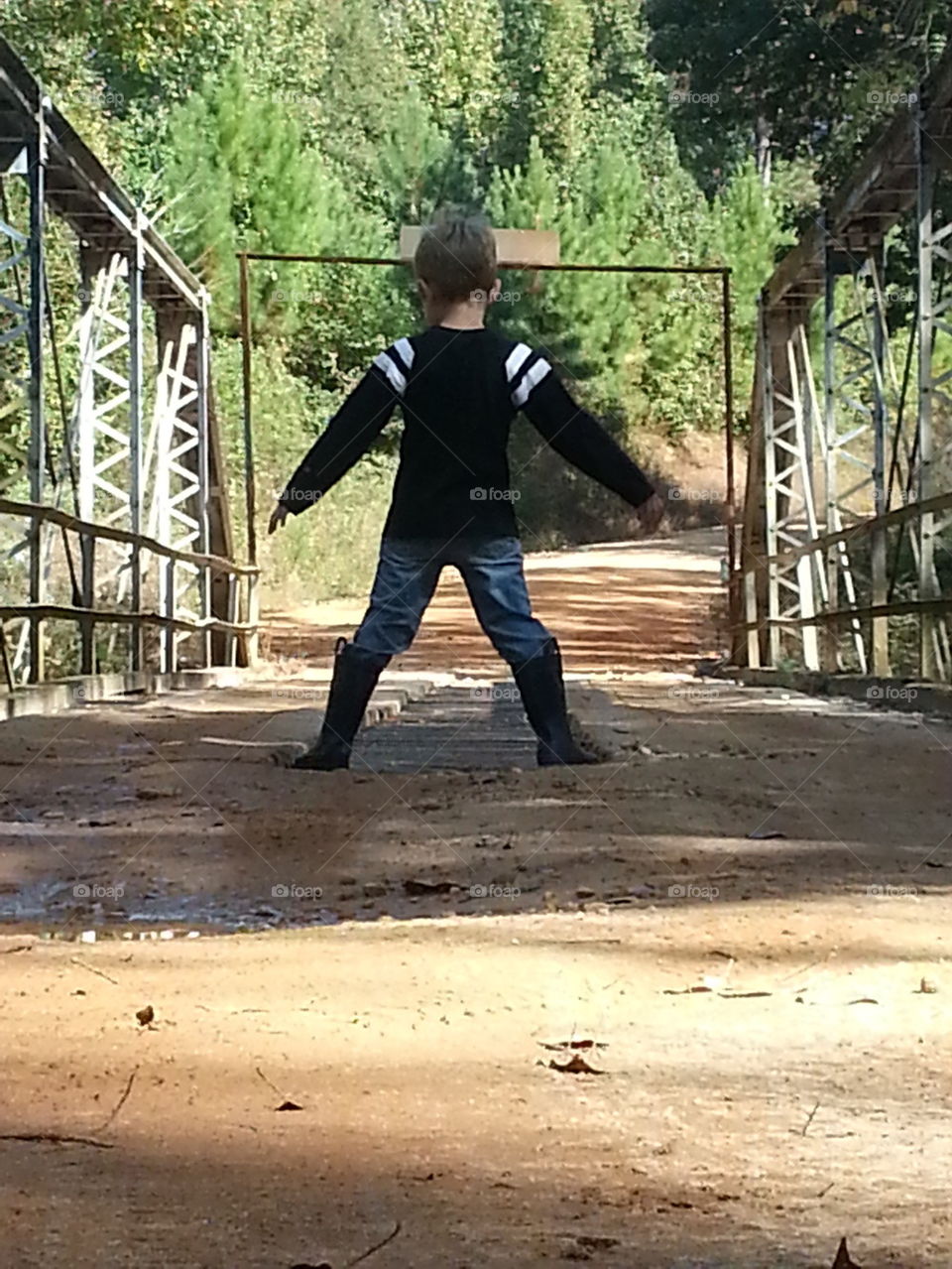 boy on bridge